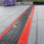 CableGuard Black Line 5-Channel Low-Profile, heavy-duty Cable Ramp Black Line 5-Channel low-profile application example on pavement (Article No. 2011132)