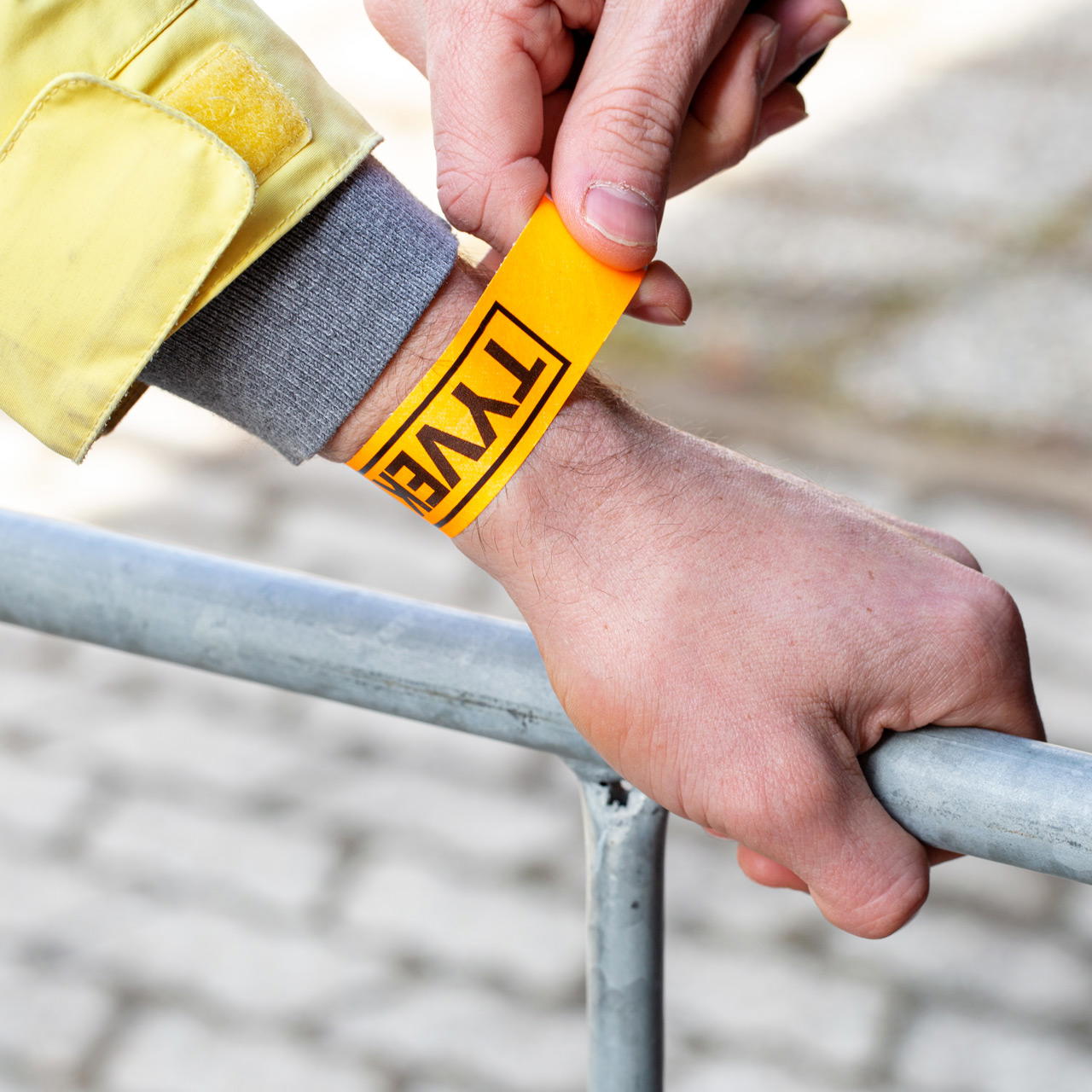 Printed single-colour 25 mm tyvek wristbands - neon orange