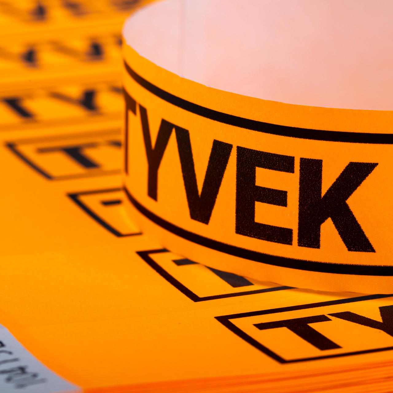 Printed single-colour 25 mm tyvek wristbands - neon orange