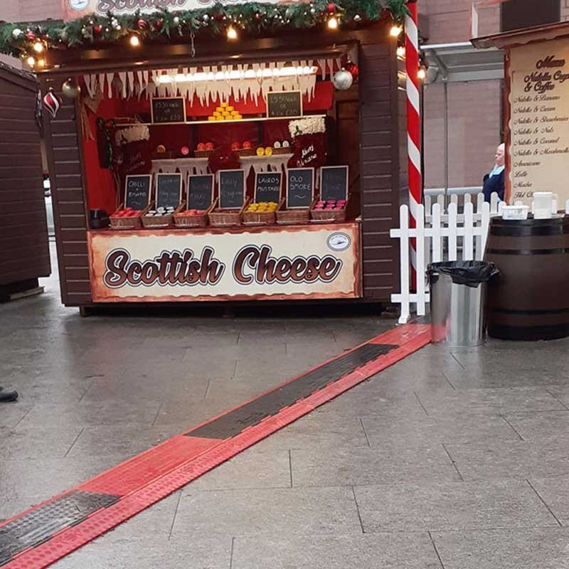 Cable Ramp Black Line 5-Channel Low Profile in use at market stall (Article No. 2011132)